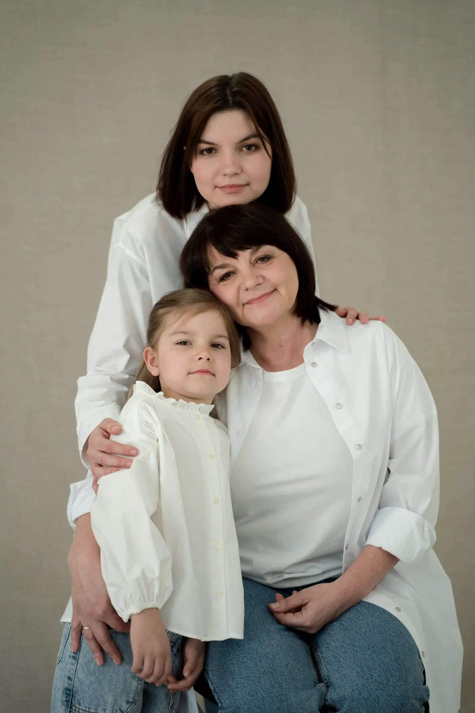 Three generations of women in a studio portrait